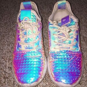 A pair of holographic sneakers